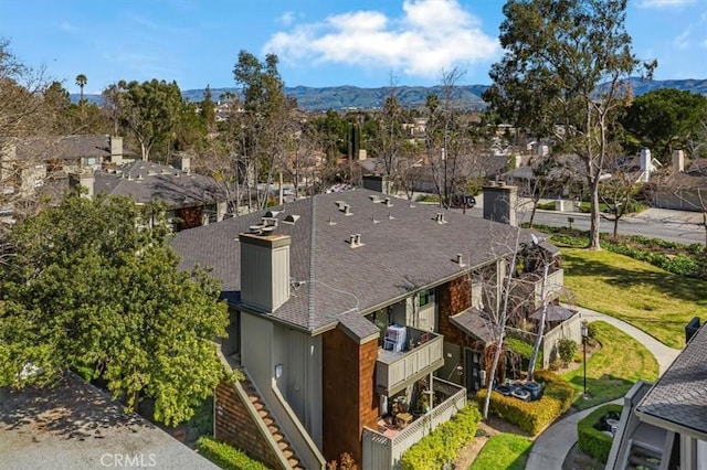 birds eye view of property featuring a mountain view and a residential view