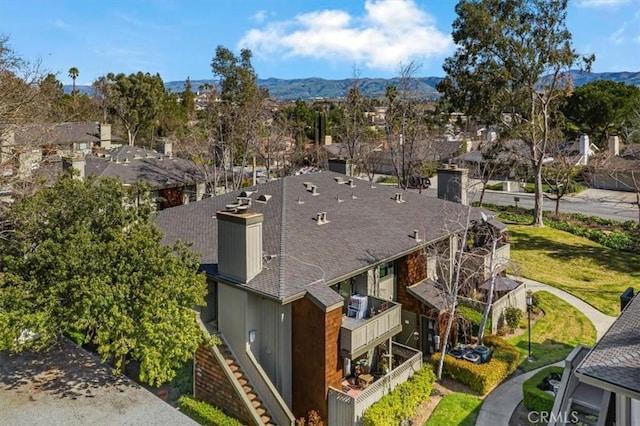 drone / aerial view featuring a mountain view and a residential view
