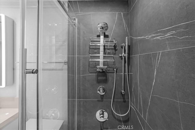 full bath featuring a shower stall