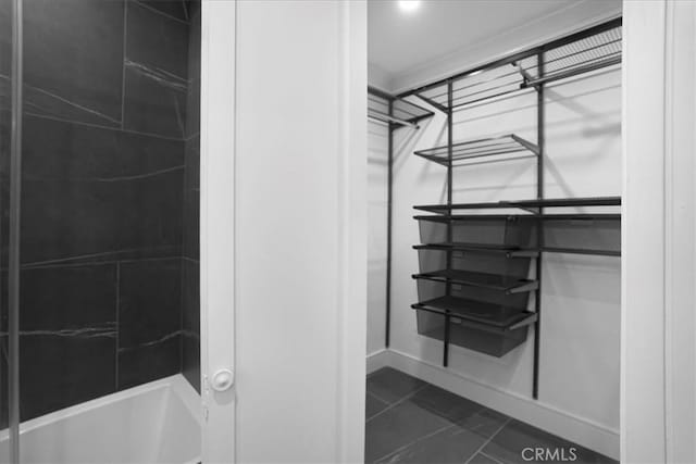 bathroom with tile patterned flooring and baseboards