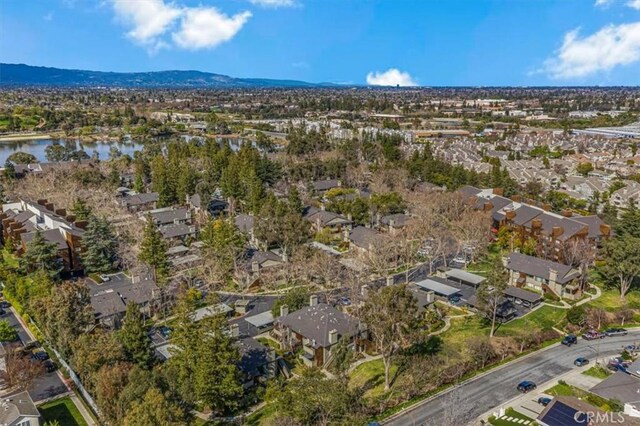 birds eye view of property featuring a residential view and a water and mountain view