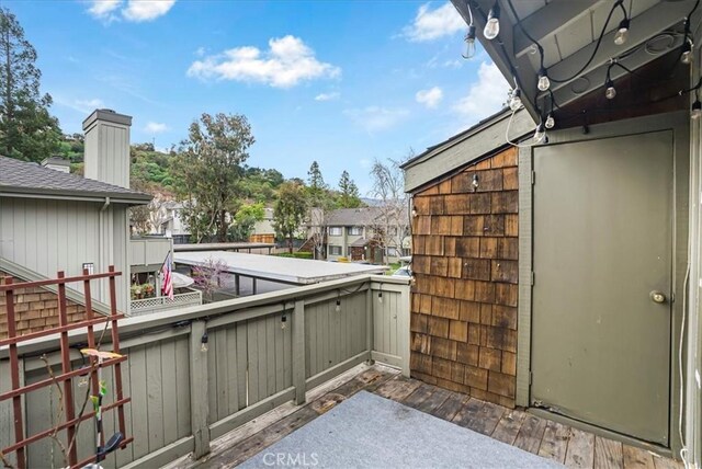 view of patio featuring a residential view and a balcony