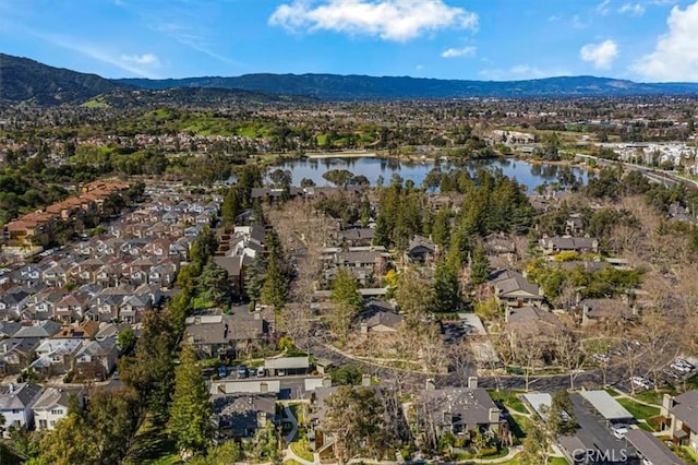 aerial view with a residential view and a water and mountain view
