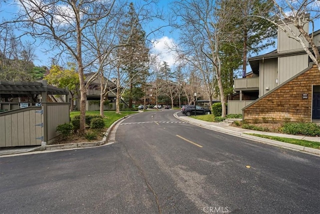 view of road featuring curbs and sidewalks