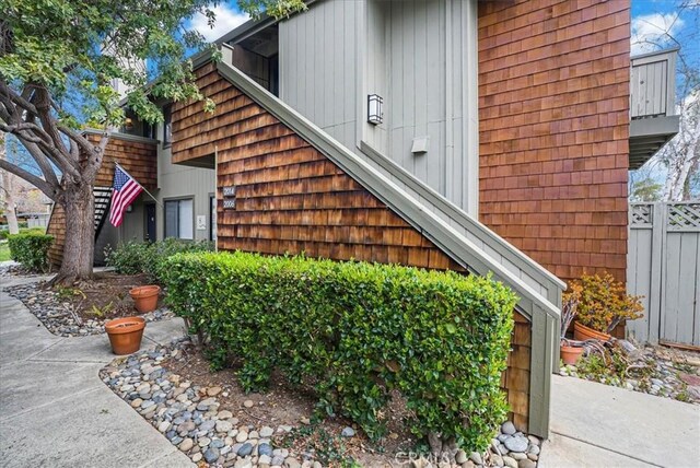 view of side of home with fence