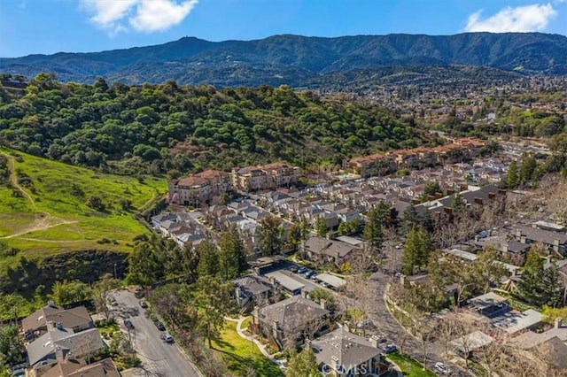aerial view featuring a mountain view and a residential view