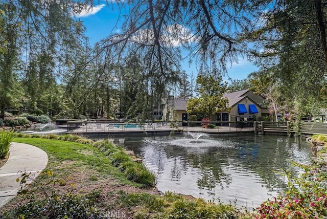 surrounding community featuring a water view