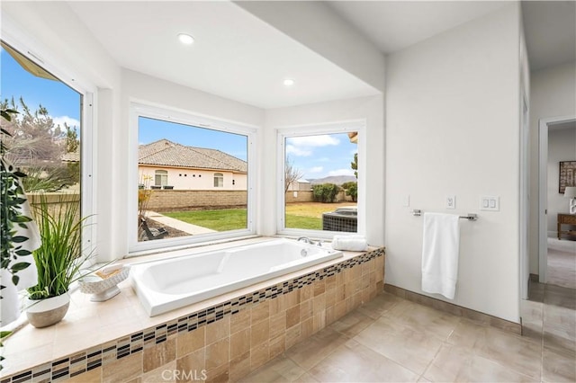 full bath with tile patterned flooring, recessed lighting, and a bath