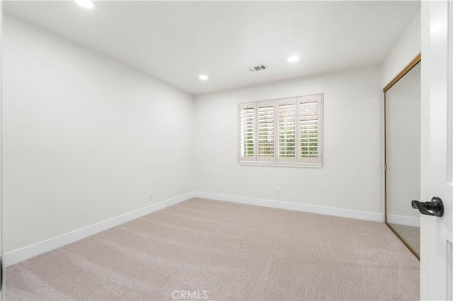 unfurnished bedroom featuring recessed lighting, carpet flooring, visible vents, and baseboards