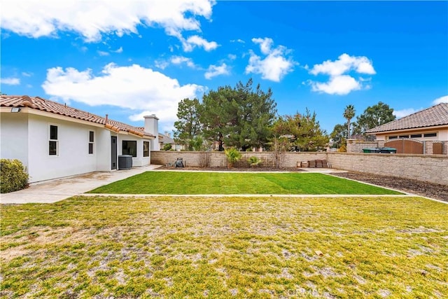 view of yard featuring a patio and central AC unit