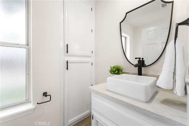 bathroom featuring visible vents and vanity