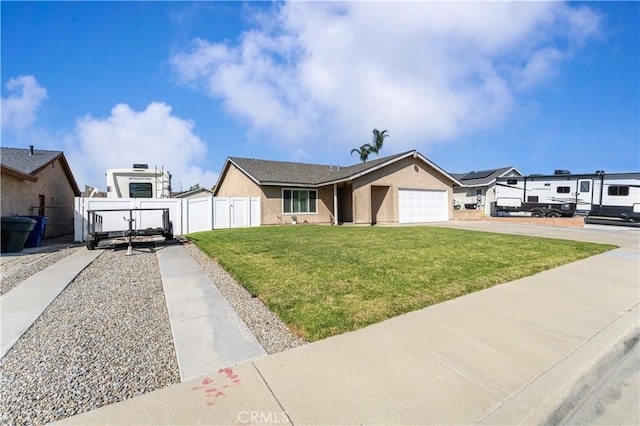 single story home featuring concrete driveway, an attached garage, a gate, fence, and a front lawn