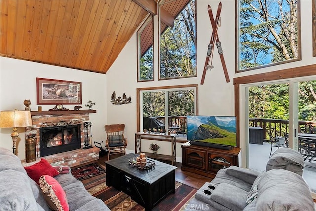 living room with wooden ceiling, a fireplace, high vaulted ceiling, and wood finished floors