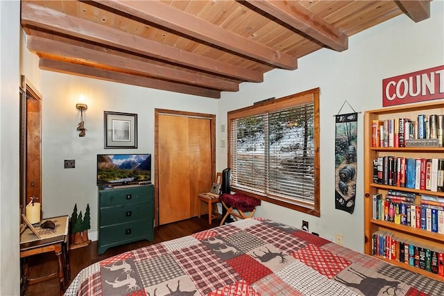 bedroom featuring a closet, wood ceiling, beamed ceiling, and wood finished floors