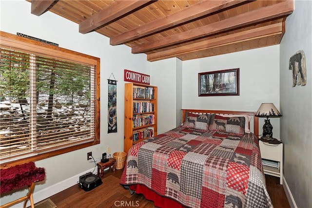 bedroom with wooden ceiling, wood finished floors, beam ceiling, and baseboards