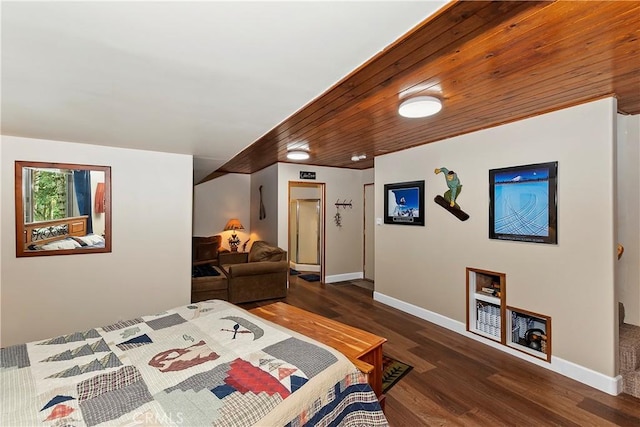 bedroom with wood finished floors and baseboards