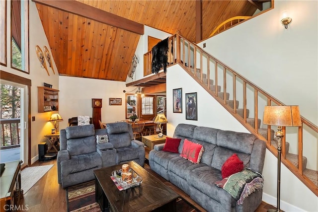 living room featuring high vaulted ceiling, wood finished floors, wood ceiling, and stairs