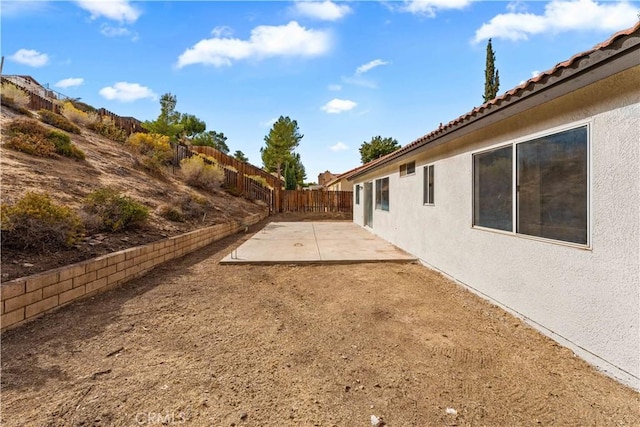 view of yard with a patio area and a fenced backyard