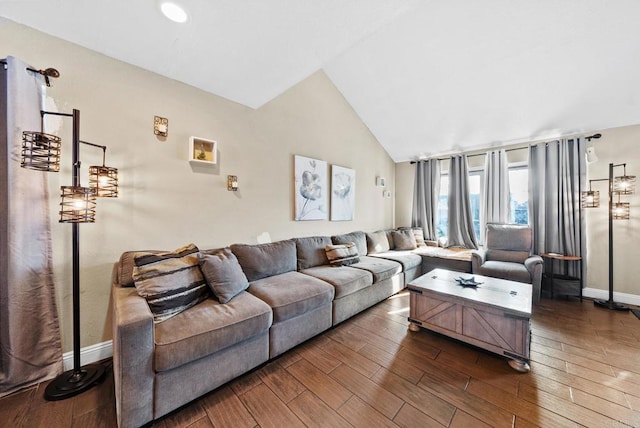 living room featuring dark wood-style floors, baseboards, and vaulted ceiling