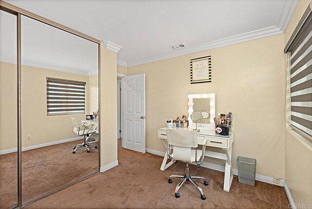 office with carpet, visible vents, baseboards, and ornamental molding