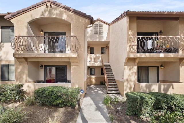 view of property featuring stairs