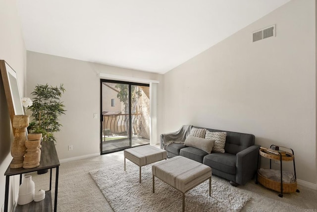 living room featuring carpet, baseboards, and visible vents