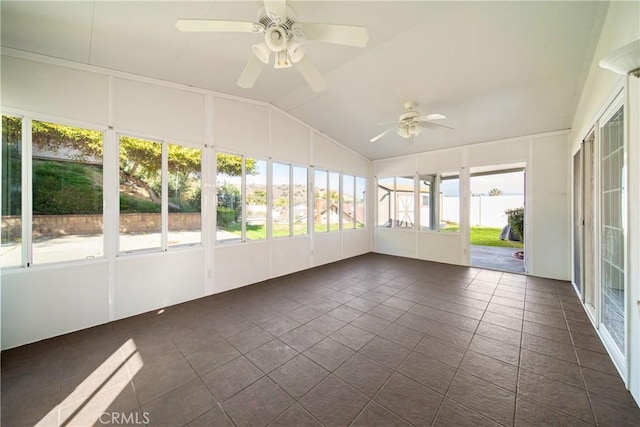 unfurnished sunroom featuring vaulted ceiling and a ceiling fan