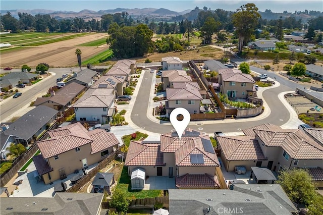 drone / aerial view with a residential view and a mountain view