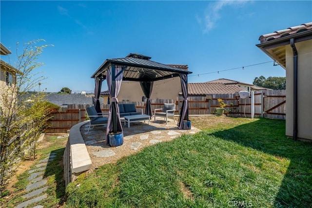 view of yard featuring a fenced backyard, an outdoor living space, a patio, and a gazebo