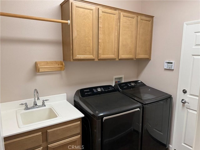 8853 Hollyhock Ct, Corona, CA 92883 - laundry area featuring cabinet space and washing machine and clothes dryer