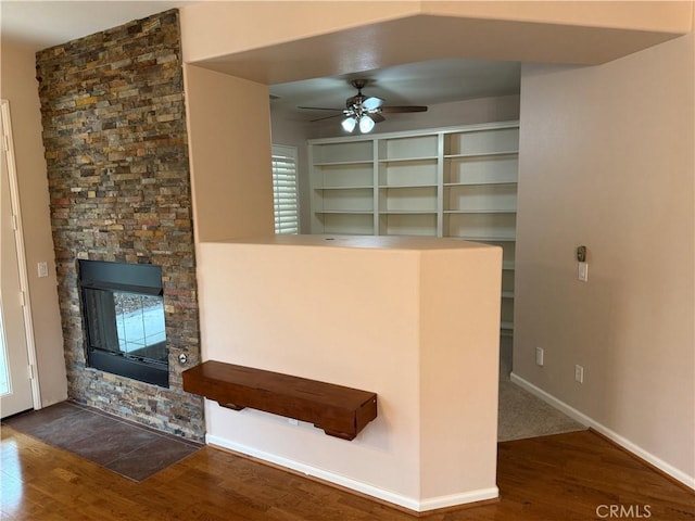 8853 Hollyhock Ct, Corona, CA 92883 - unfurnished living room featuring wood finished floors, ceiling fan, a fireplace, and baseboards