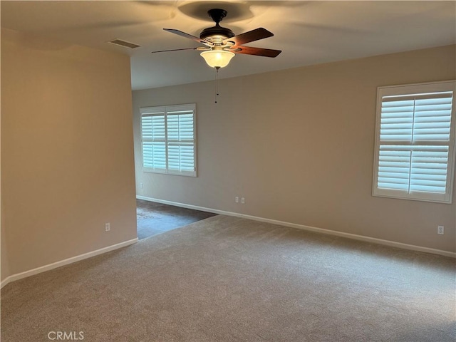8853 Hollyhock Ct, Corona, CA 92883 - unfurnished room with ceiling fan, dark colored carpet, and baseboards