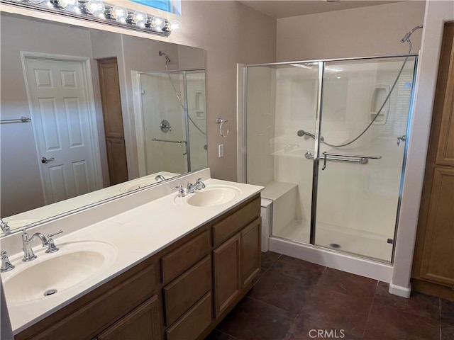 8853 Hollyhock Ct, Corona, CA 92883 - bathroom featuring a stall shower, tile patterned flooring, and double vanity