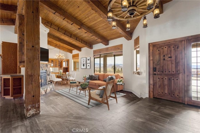 interior space with a chandelier, high vaulted ceiling, wood finished floors, wood ceiling, and beamed ceiling