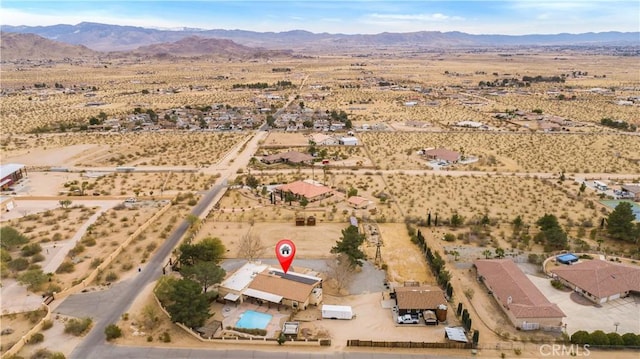 aerial view featuring view of desert, a rural view, and a mountain view