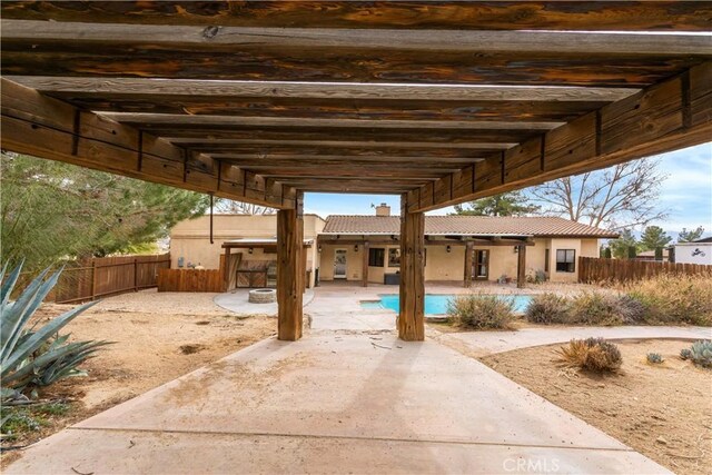 view of patio featuring fence and a fenced in pool