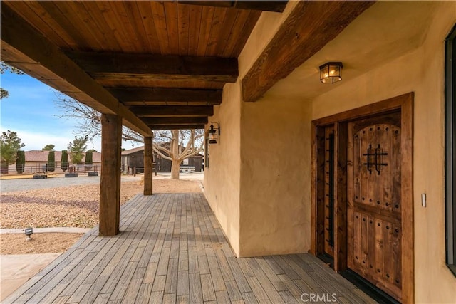 wooden terrace featuring a patio