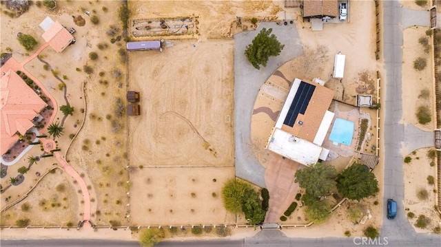 birds eye view of property with view of desert