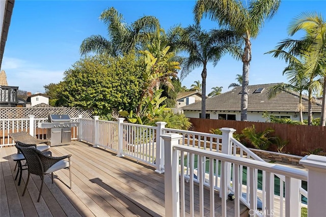 deck featuring fence and grilling area