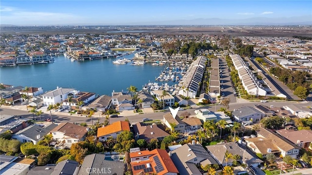 bird's eye view with a residential view and a water view