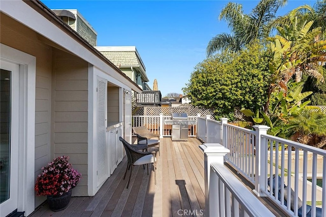 wooden deck with area for grilling