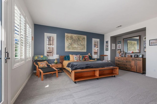 bedroom featuring visible vents, baseboards, and carpet flooring