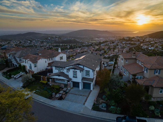 aerial view at dusk with a residential view and a mountain view