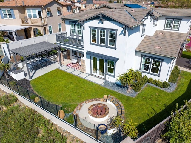 back of property featuring a patio, stucco siding, french doors, and fence private yard