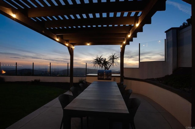 view of patio / terrace with outdoor dining space and a pergola