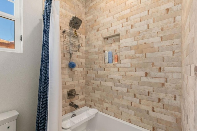 bathroom featuring toilet and shower / bath combo