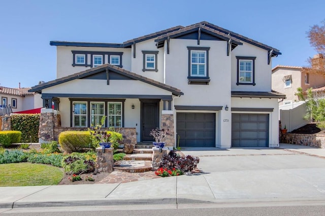 view of front of home featuring fence, stucco siding, concrete driveway, a garage, and a tile roof