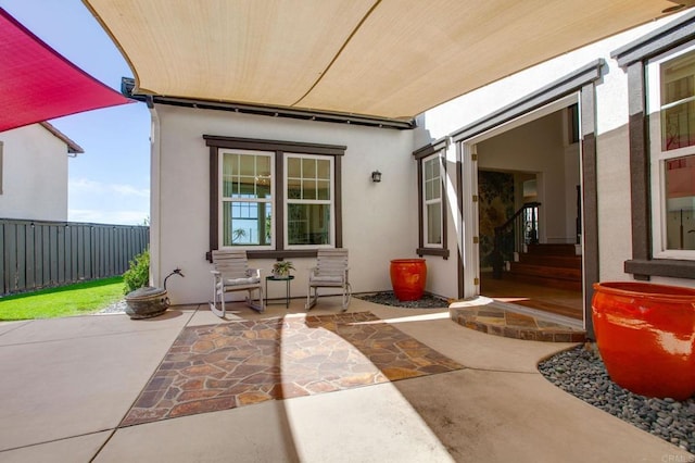 view of patio / terrace featuring fence