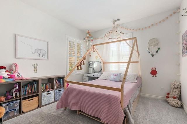 bedroom featuring carpet flooring, multiple windows, baseboards, and visible vents