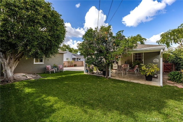 view of yard featuring a patio area and fence